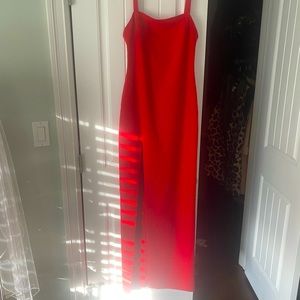 Likely red gown with slit!